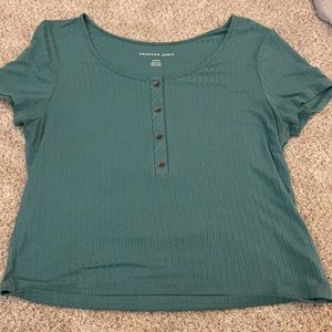 Size medium blue american eagle button up tshirt